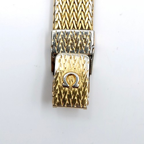 595 - Star Lot : An Omega De Ville ladies wristwatch with original gold metal mesh bracelet. Boxed.