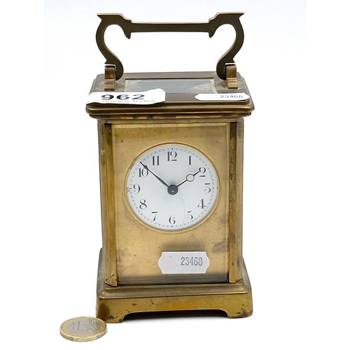 962 - An antique mechanical carriage clock, good example with glass sides and top and original key.