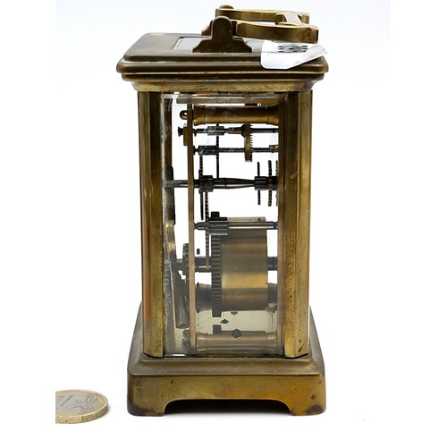 962 - An antique mechanical carriage clock, good example with glass sides and top and original key.