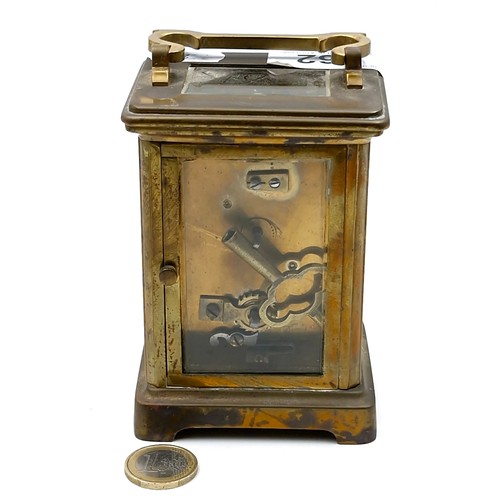 962 - An antique mechanical carriage clock, good example with glass sides and top and original key.