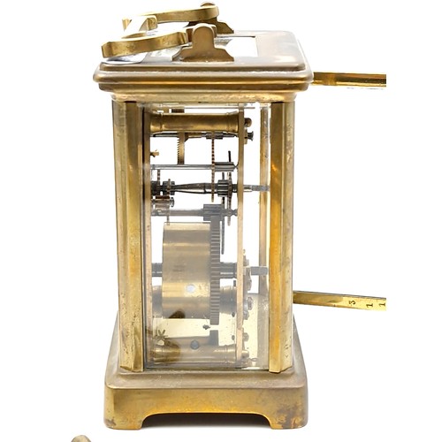 962 - An antique mechanical carriage clock, good example with glass sides and top and original key.