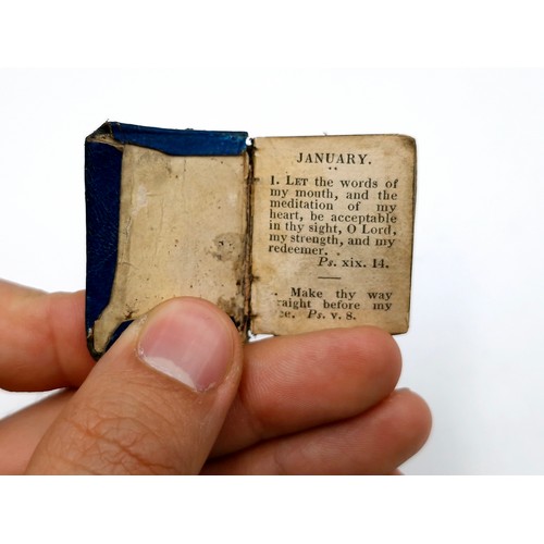 965 - A miniature just over an inch leather bound book with dialy religious versus. No date but would say,... 