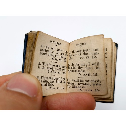 965 - A miniature just over an inch leather bound book with dialy religious versus. No date but would say,... 