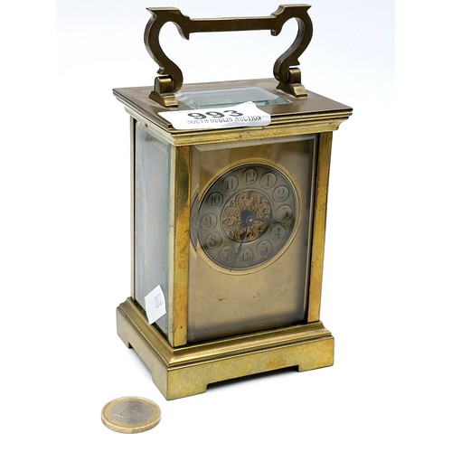 993 - A good antique brass French mechanical carriage clock with glass sides and top.