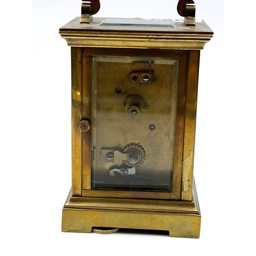 993 - A good antique brass French mechanical carriage clock with glass sides and top.