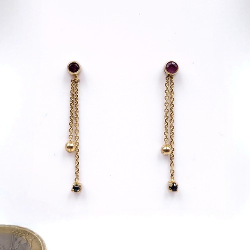 11 - A pair of drop tassel ruby stone stud earrings. Weight - 0.87 grams.