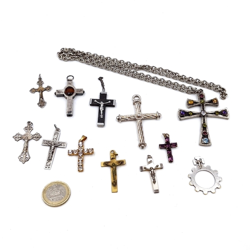 40 - A collection of twelve religious crosses - five set with crucifix. One with chain (Length - 68 cms).... 