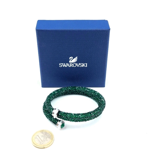 425 - An as new Swarovski green crystal bracelet. Comes in original box.