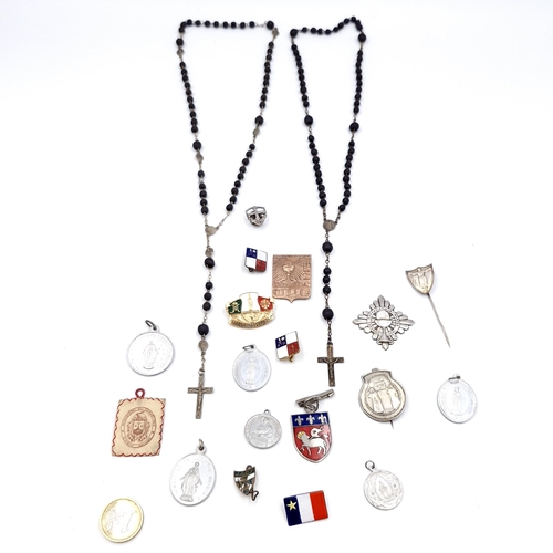 44 - A collection of religious medals/medallions. Together with two sets of rosary beads. Items as per ph... 