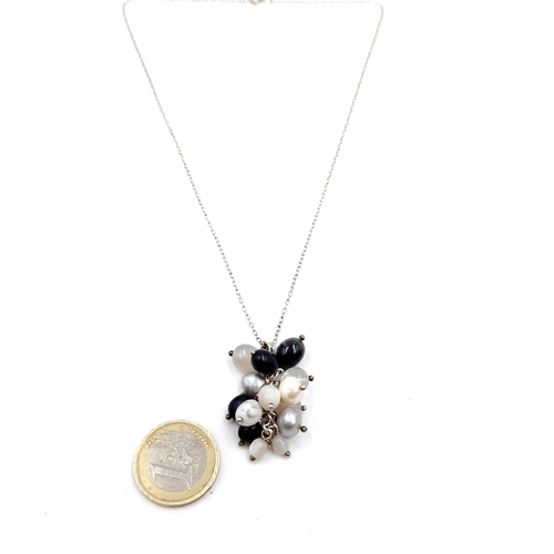 449 - A multi stone & pearl cluster pendant necklace. Length of chain - 40 cms. Weight - 11.11 grams.