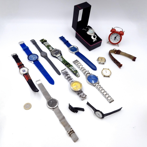 450 - A collection 12 watches together with a 'Seksy' watch in its original box and a miniature quartz ala... 