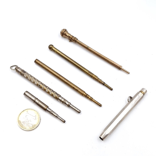 466 - A collection of six vintage pencils. Some with machine cut detailing, one set with a citrine stone m... 