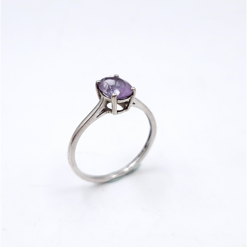 472 - A sterling silver amethyst stone ring. Size - Q. Weight - 1.34 grams. Boxed.