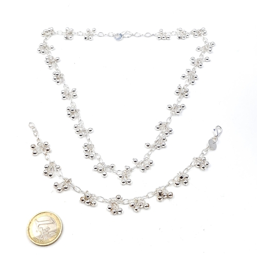 474 - A sterling silver set comprising of a necklace & bracelet with silver ball accents. Length of neckla... 