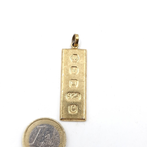 476 - A sterling silver gilt ingot. Weight - 13.96 grams.