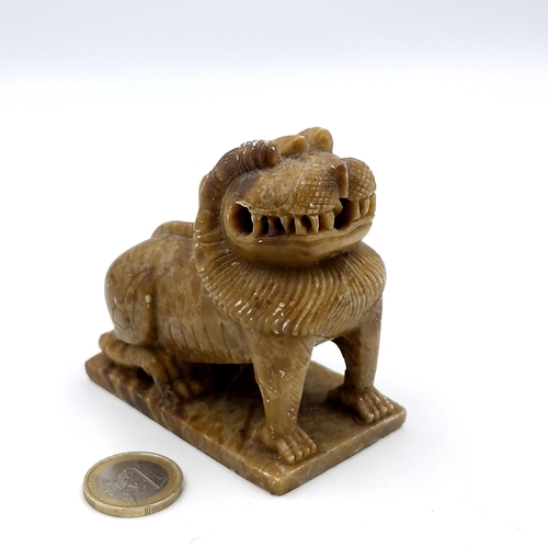 488 - An antique Chinese food dog carved in soap stone. Dimensions: 8 x 8 (L x H). Weight - 360 grams.