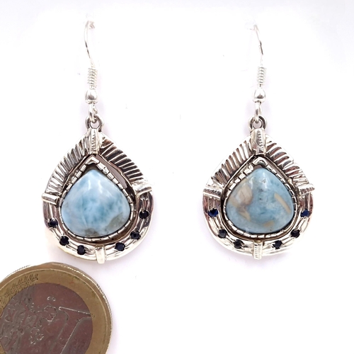 59 - Star Lot : A pair of polished agate teardrop silver mounted earrings - suitable for pierced ears. We... 