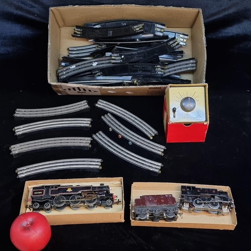 121 - A box containing a vintage Hornby 80054 and two TTR model railway engines along with train track and... 