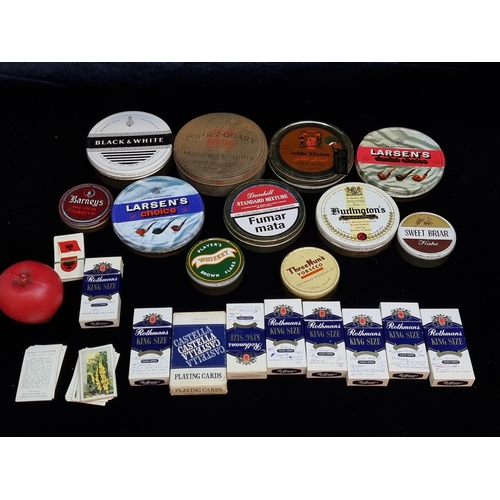 127 - A collection of vintage tobacco items including tins, boxes full of cigarette cards and an advertisi... 