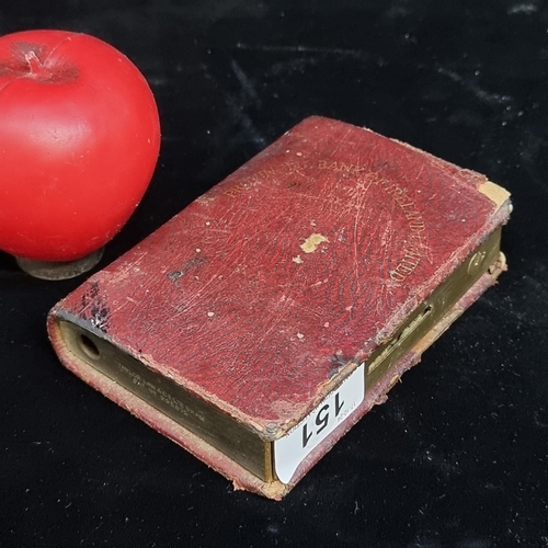 151 - An antique provincial Bank of Ireland limited moneybox in the form of a book. Stamped 'tailor law & ... 