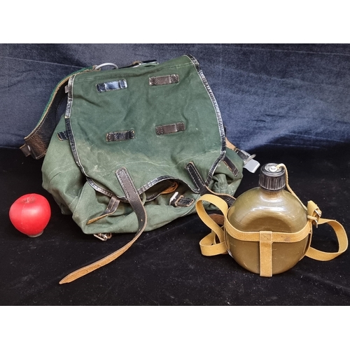 162 - A 1972 Hans Romer Neu-Ulm military backpack with military water bottle. Brand and stamped date to th... 