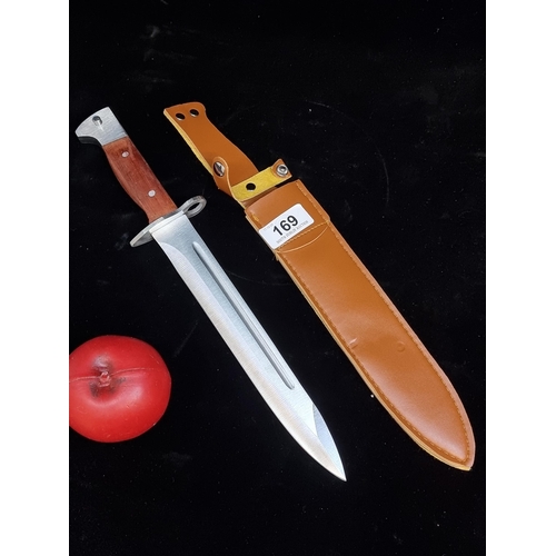 169 - An AK-47CCP hunting knife with original tan sheath.