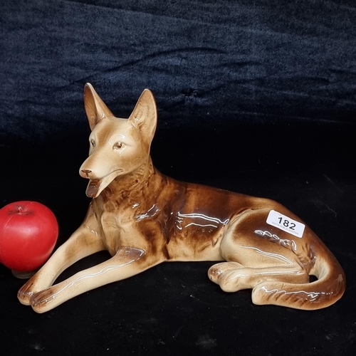 182 - A large vintage French made porcelain figure of a German Shepard dog. Stamped 'France' and numbered ... 