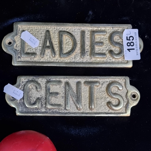 185 - A pair of cast brass ladies and gents toilet plaques.