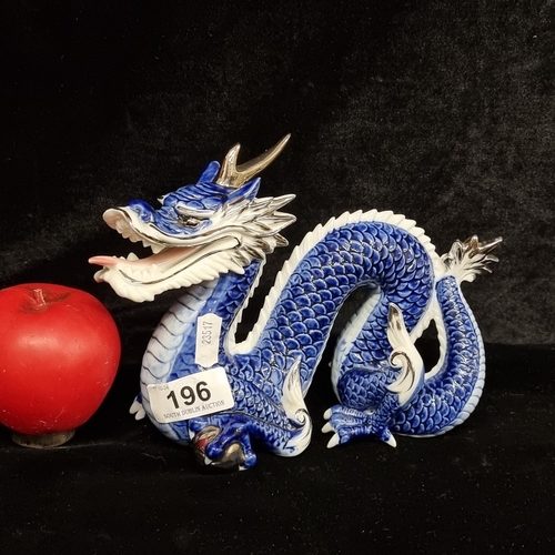 196 - A vintage Yoshimi porcelain blue and white Chinese dragon figure. In very good condition, unmarked.