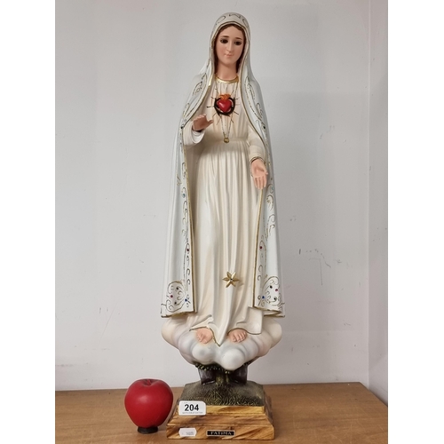 204 - A tall hand painted religious figure of 