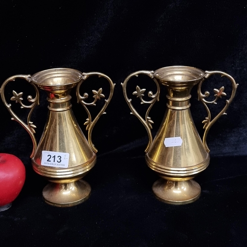 213 - A vintage pair of very heavy solid brass double handled church vases.