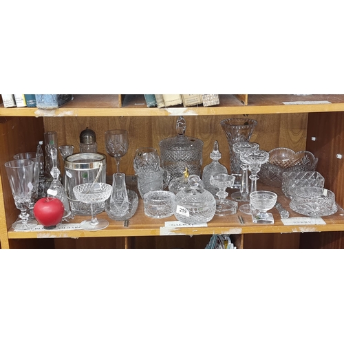 219 - A full shelf and impressive selection of crystal items including ice buckets, candle stick holders, ... 