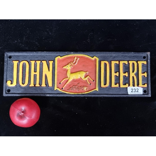 232 - A heavy cast metal advertising wall plaque for John Deere machinery.