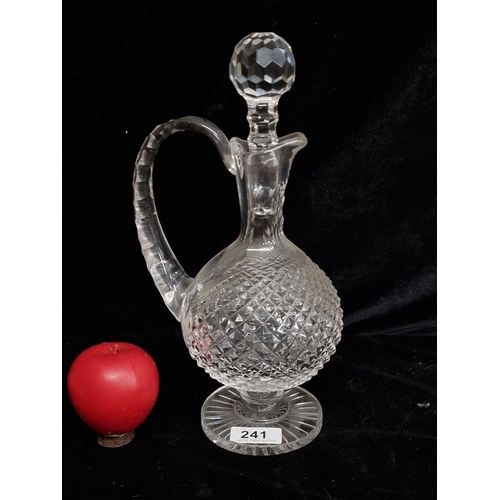 241 - A beautiful Waterford Crystal decanter Claret jug with original stopper. In good condition with acid... 