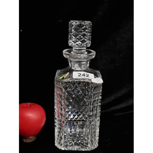 242 - A Waterford Crystal square diamond step master cut decanter with original stopper. In good condition... 