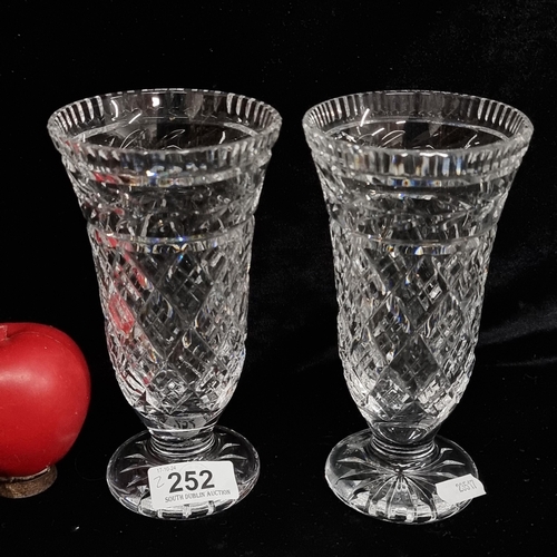 252 - A pair of large Waterford Crystal flower vases. Both in good condition with acid marks to base.