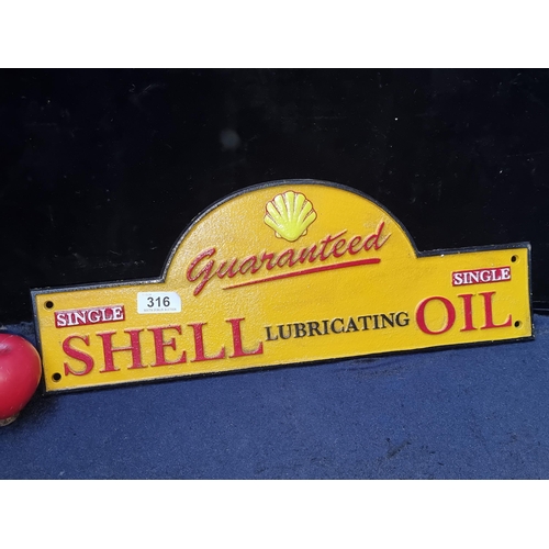 316 - A heavy cast metal advertising sign for Shell Lubricant Oil.