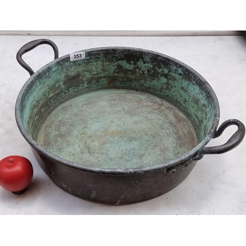 353 - A large antique solid copper doubled handed preserve / cooking pot. With lovely verdigris finish, in... 