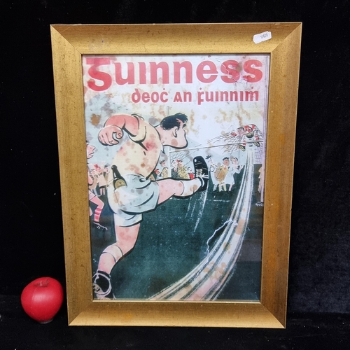 65 - A print / advertising featuring Guinness Gaelic Football. Housed in a gilt frame behind glass.