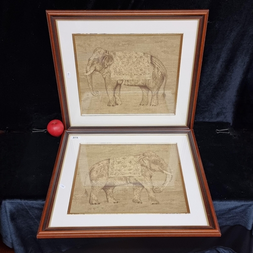 75 - A pair of watercolour on jute canvas paintings. Featuring decorated Indian elephants. Both housed in... 