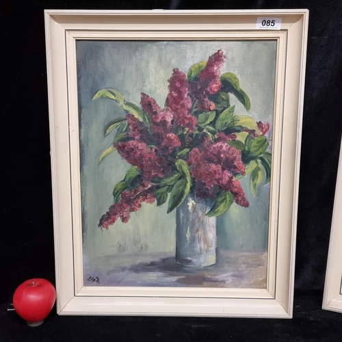 85 - An admirable original oil on board painting. Features a still life botanical study of flowers in a v... 