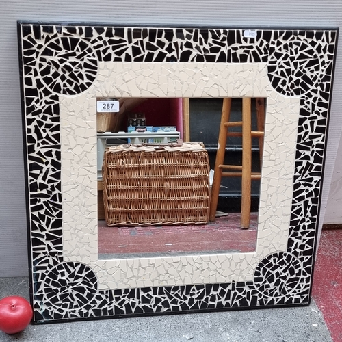 287 - A handsome tiled wall mirror in very good condition. Heavy, good quality.