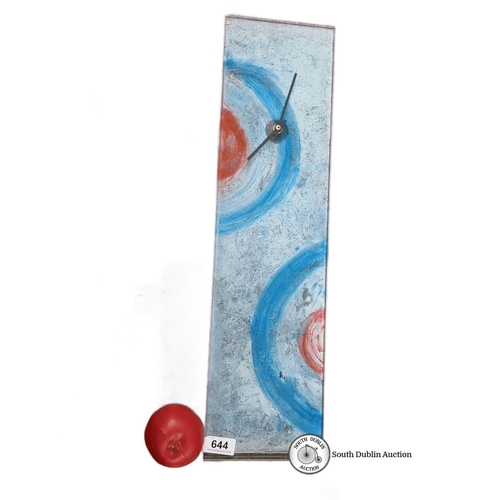 644 - Wall clock with bold blue and red circular patterns on glass. Approximately 50 cm in height. Battery... 