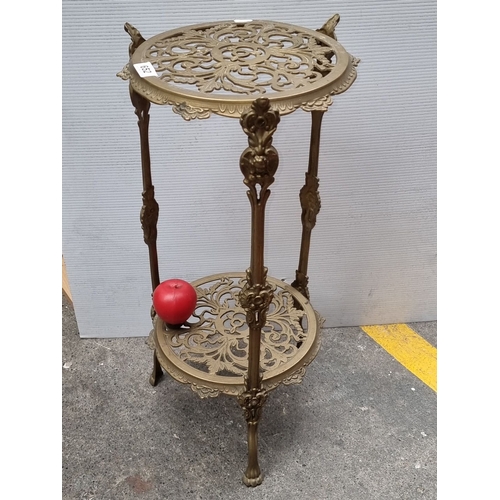 652 - Brass Victorian-style plant stand with ornate filigree detailing. Approximately 30 inches tall.