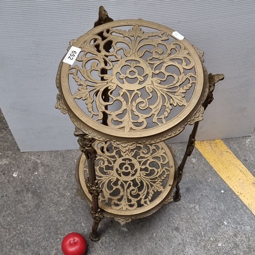 652 - Brass Victorian-style plant stand with ornate filigree detailing. Approximately 30 inches tall.