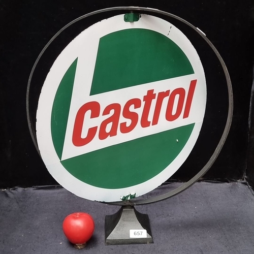 657 - Vintage Castrol advertising sign with circular design, mounted on a metal stand. Approximately 24 in... 