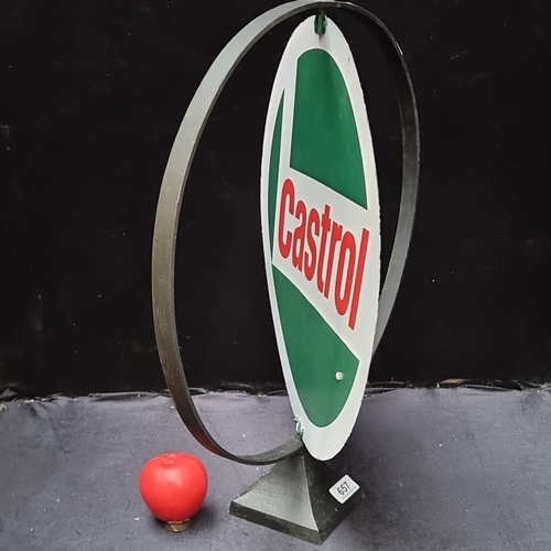 657 - Vintage Castrol advertising sign with circular design, mounted on a metal stand. Approximately 24 in... 