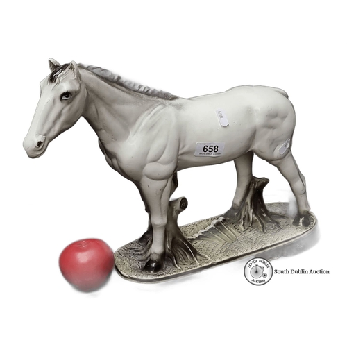 658 - A large Porcelain horse figurine on an oval base, featuring a detailed and lifelike design. Approxim... 