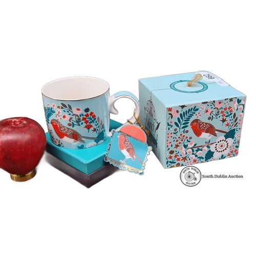 662 - Bone china mug with bird motif. Includes original decorative box.