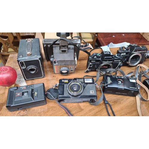 665 - Collection of vintage cameras including Kodak VR35, Praktica models, Hanimex 35 HS, Polaroid Color S... 